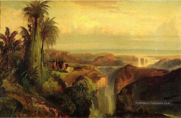 Indiens sur un paysage de falaise Thomas Moran Peinture à l'huile